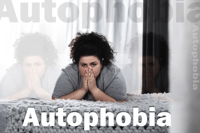 Image of Depressed overweight woman alone on bed at home. Autophobia - fear of isolation