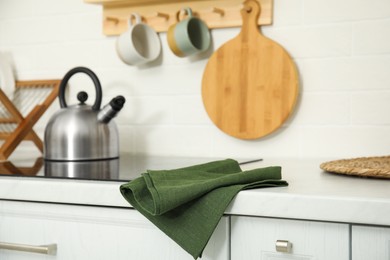 Photo of Clean towel on white countertop in kitchen