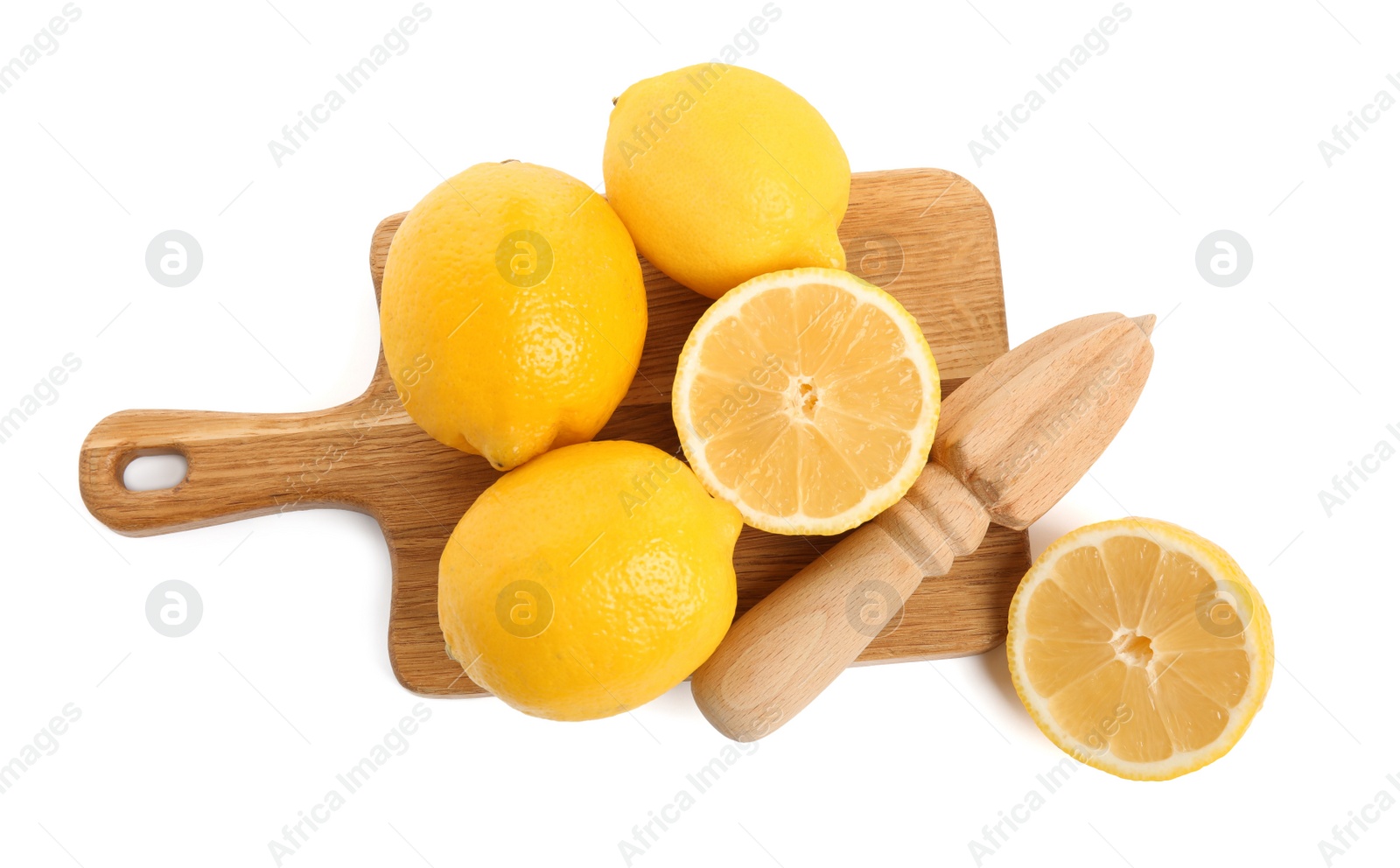 Photo of Wooden juicer and fresh lemons on white background, top view