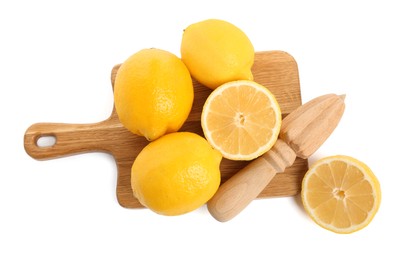 Photo of Wooden juicer and fresh lemons on white background, top view