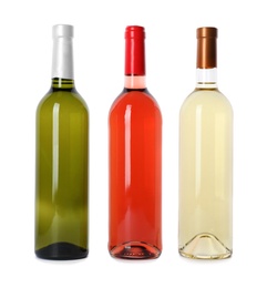 Bottles of expensive wines on white background