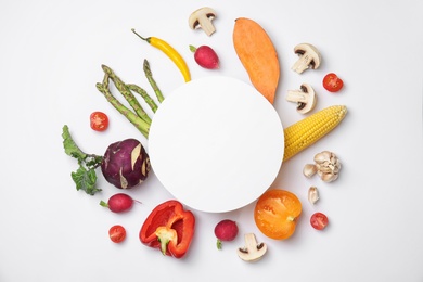 Photo of Flat lay composition with fresh vegetables and blank card for text on white background