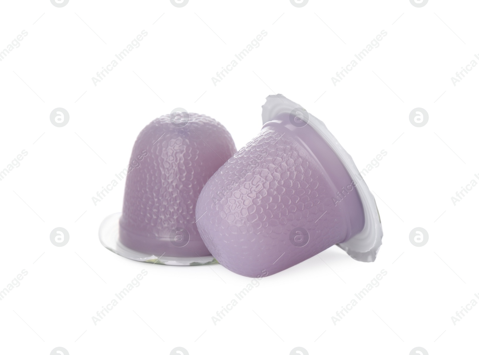 Photo of Delicious violet jelly cups on white background