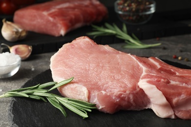 Photo of Fresh raw cut meat on slate plate