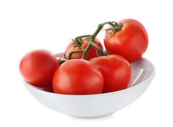 Branch of fresh ripe tomatoes in bowl on white background