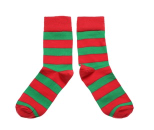 Photo of Striped socks on white background, top view