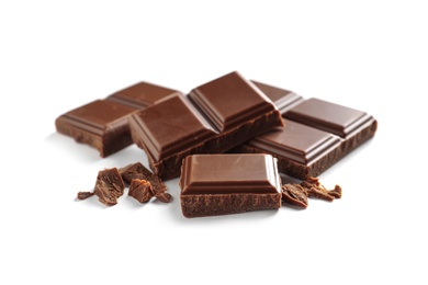 Pieces of tasty milk chocolate on white background