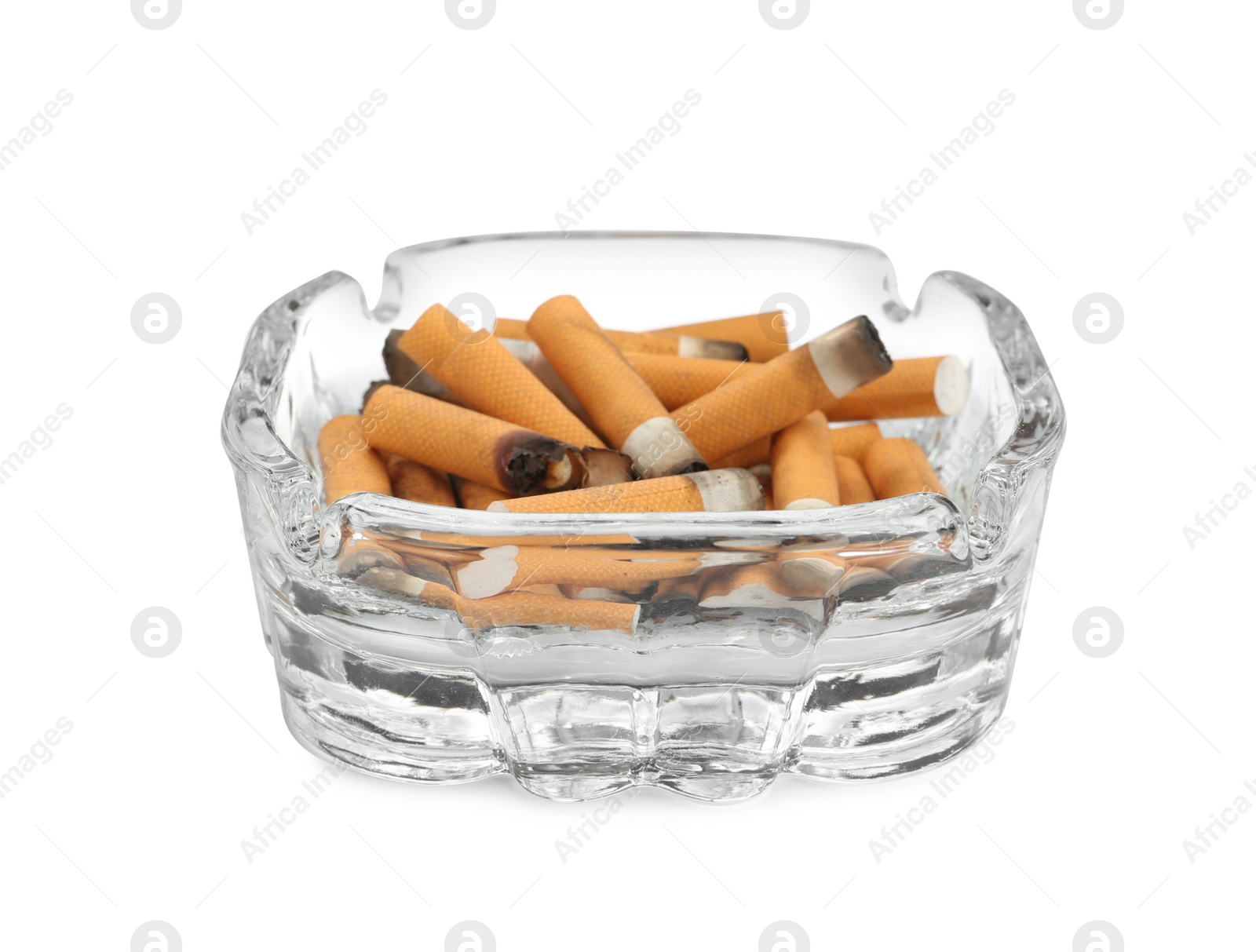 Photo of Glass ashtray with cigarette stubs isolated on white