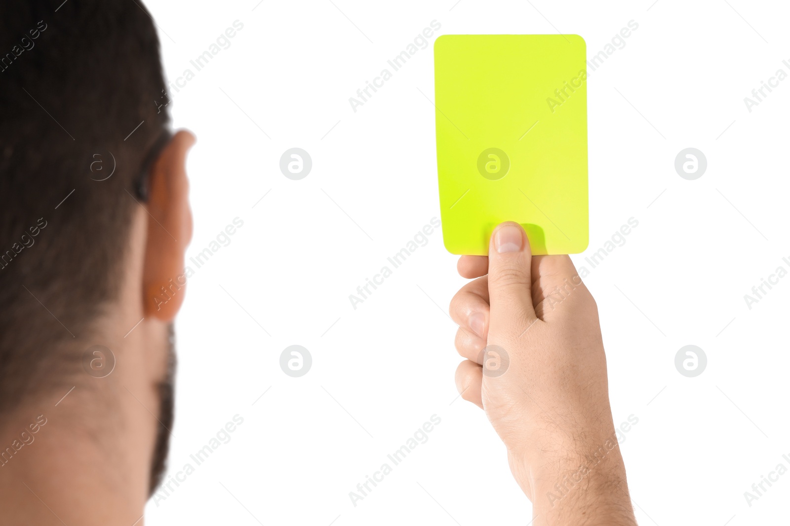 Photo of Referee holding yellow card on white background, closeup