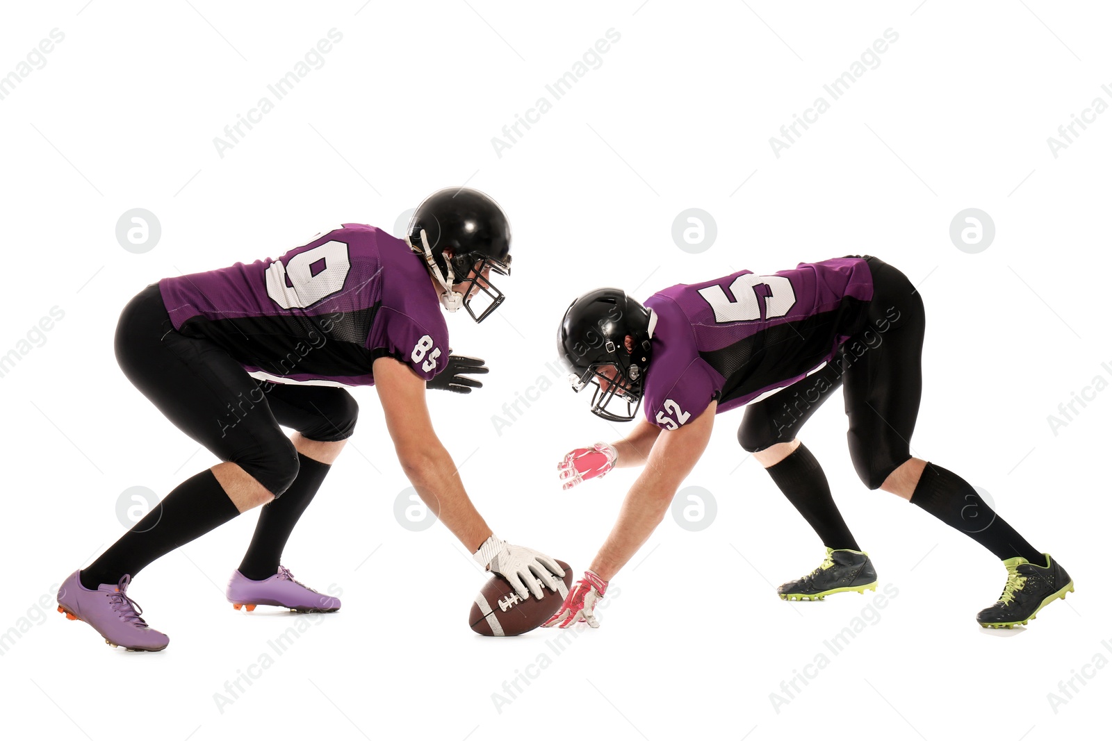 Photo of Men in uniform playing American football on white background