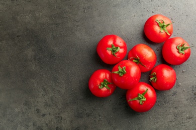 Photo of Fresh ripe tomatoes on grey background, top view