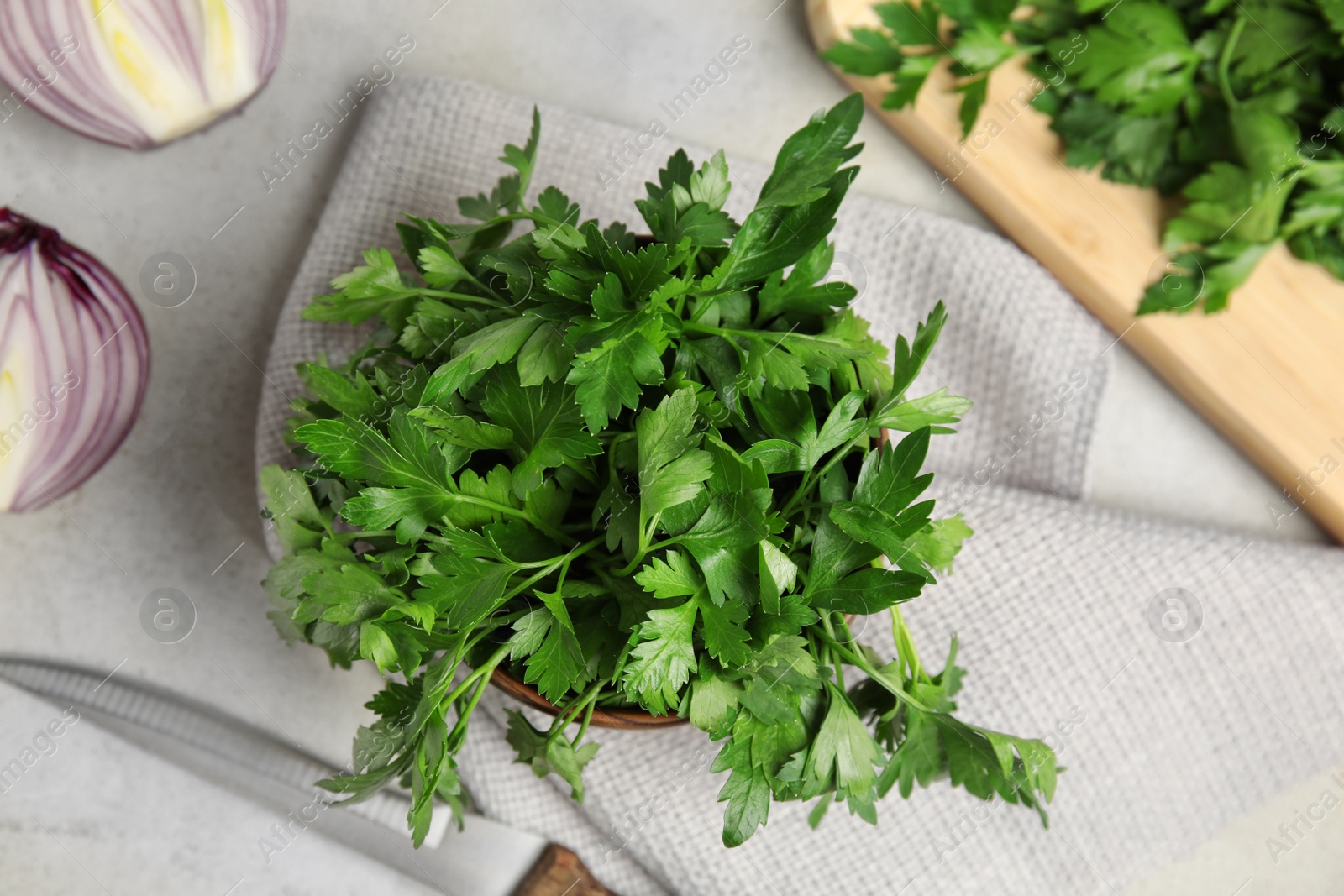 Photo of Flat lay composition with fresh green parsley on table