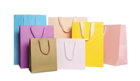 Photo of Colorful paper shopping bags isolated on white