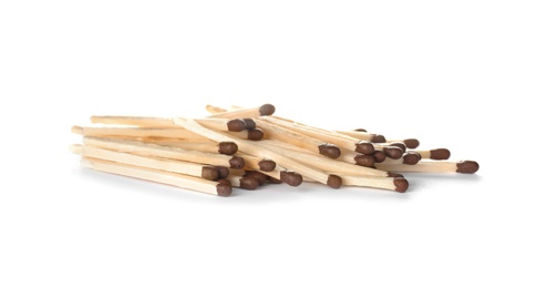 Photo of Pile of wooden matches on white background