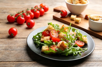 Photo of Delicious fresh chicken salad served on wooden table