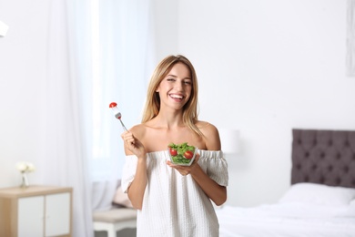 Photo of Happy slim woman with salad at home. Weight loss diet