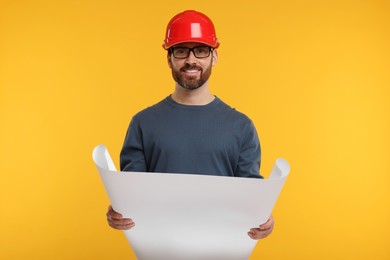 Architect in hard hat with draft on orange background