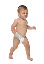 Cute baby in diaper learning to walk on white background