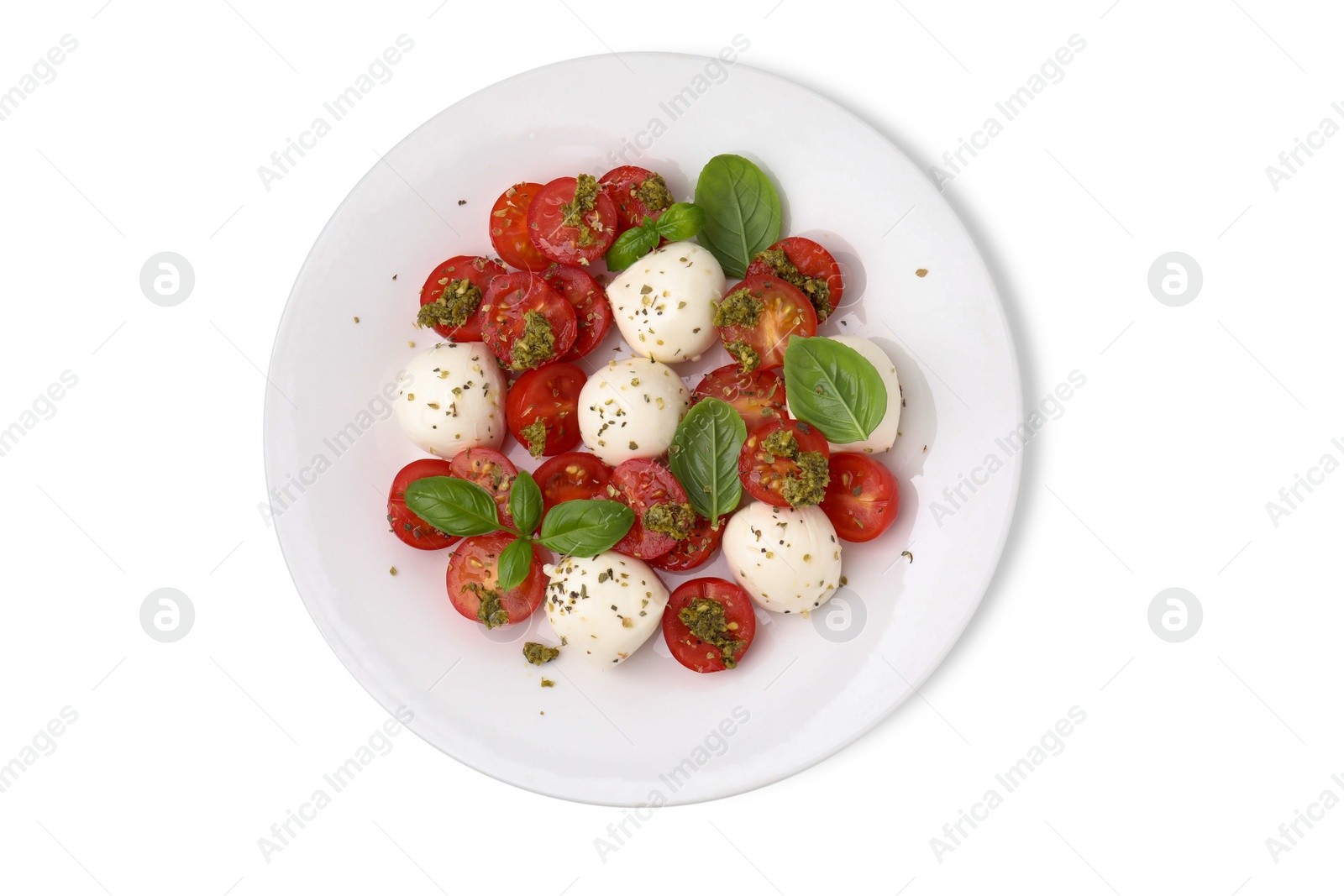 Photo of Plate of tasty salad Caprese with tomatoes, mozzarella balls and basil isolated on white, top view