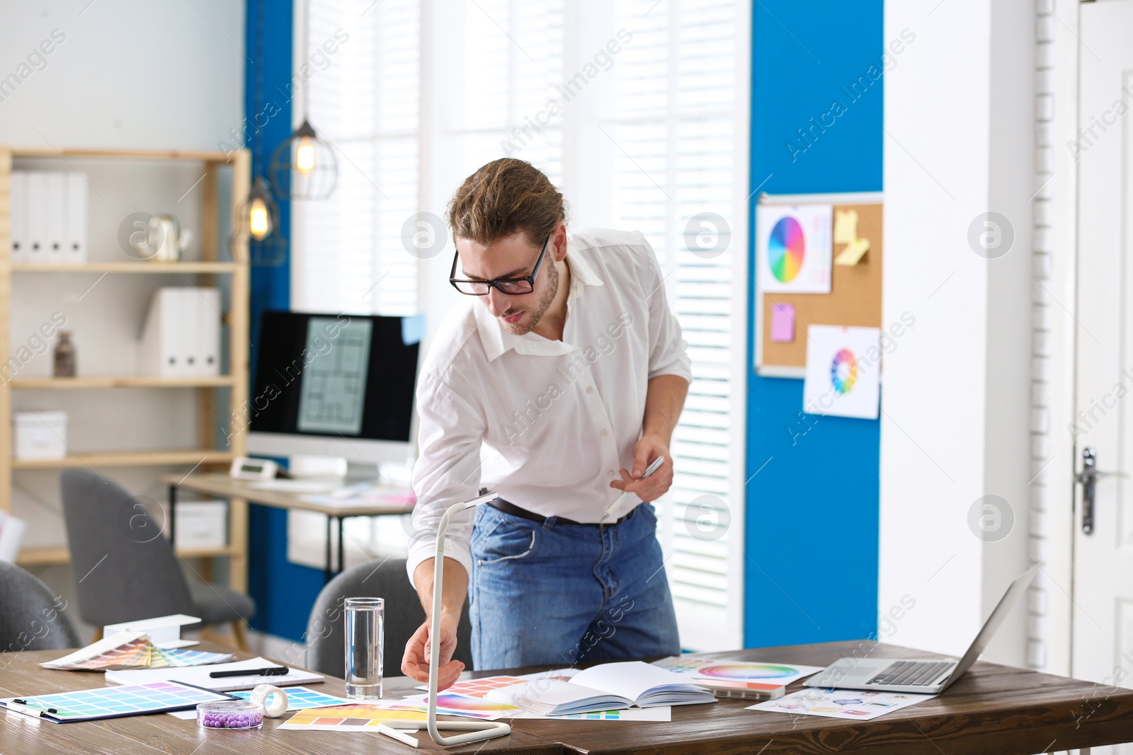 Photo of Professional interior designer at workplace in office