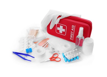 Photo of First aid kit, scissors, gloves, pills, cotton buds, plastic forceps, hand sanitizer and elastic bandage on white background. Health care