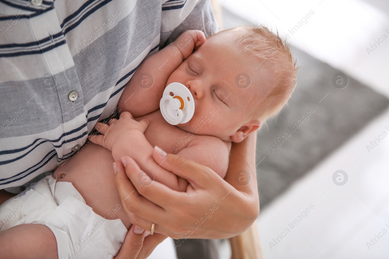 Photo of Mother with her newborn baby, closeup view