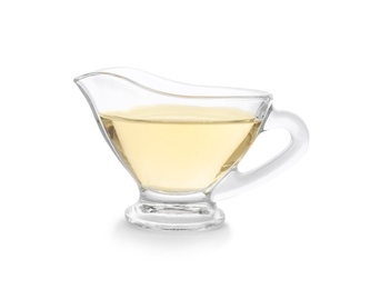Photo of Apple vinegar in glass gravy boat on white background