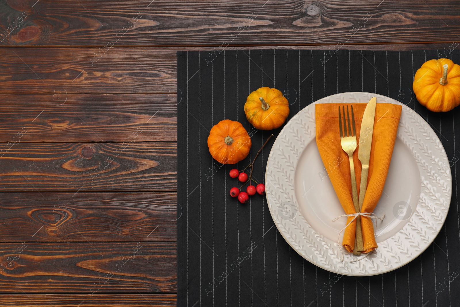 Photo of Autumn table setting and pumpkins, flat lay. Space for text