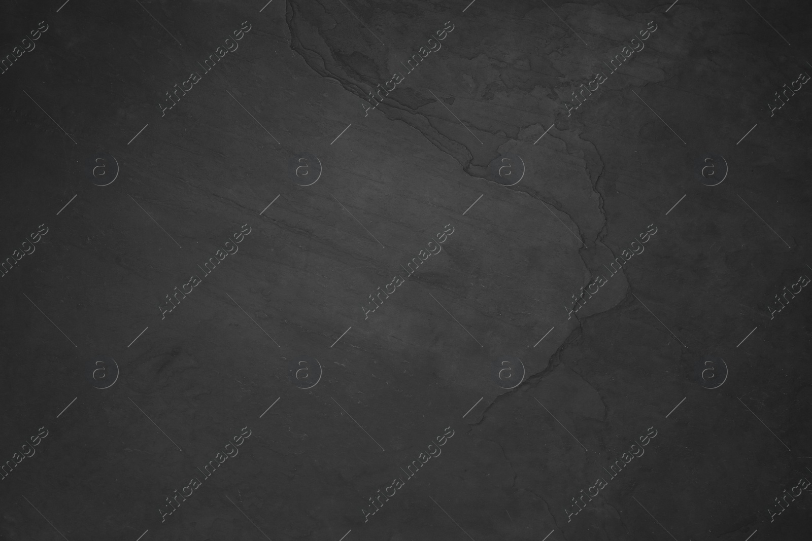 Photo of Black slate surface as background, top view