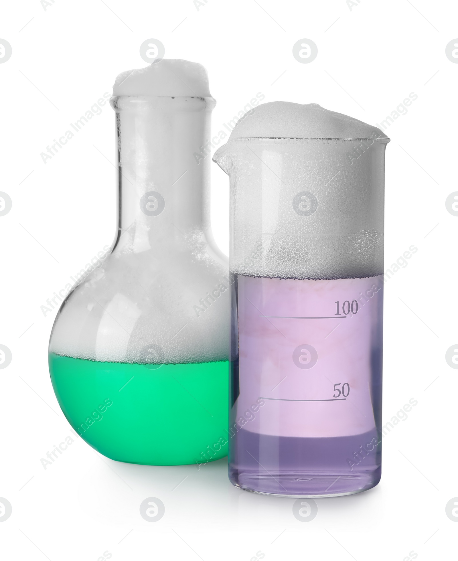 Photo of Laboratory glassware with colorful liquids isolated on white. Chemical reaction