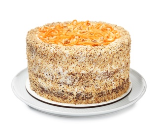 Dish with delicious carrot cake on white background