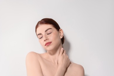 Portrait of beautiful woman on light background