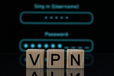 Photo of Acronym VPN (Virtual Private Network) made of wooden cubes on dark background