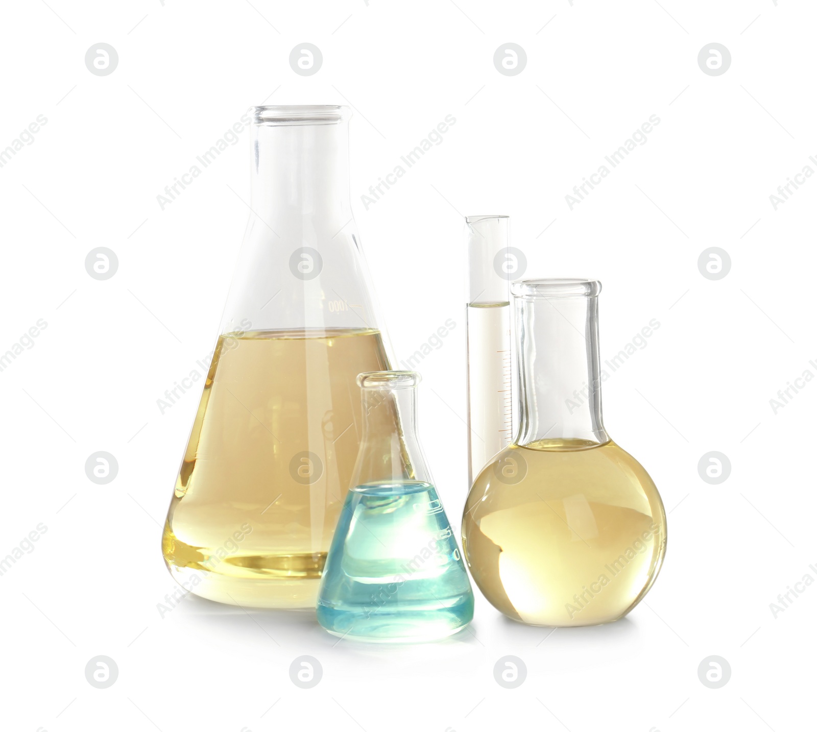 Photo of Laboratory glassware with liquid on white background. Chemical analysis