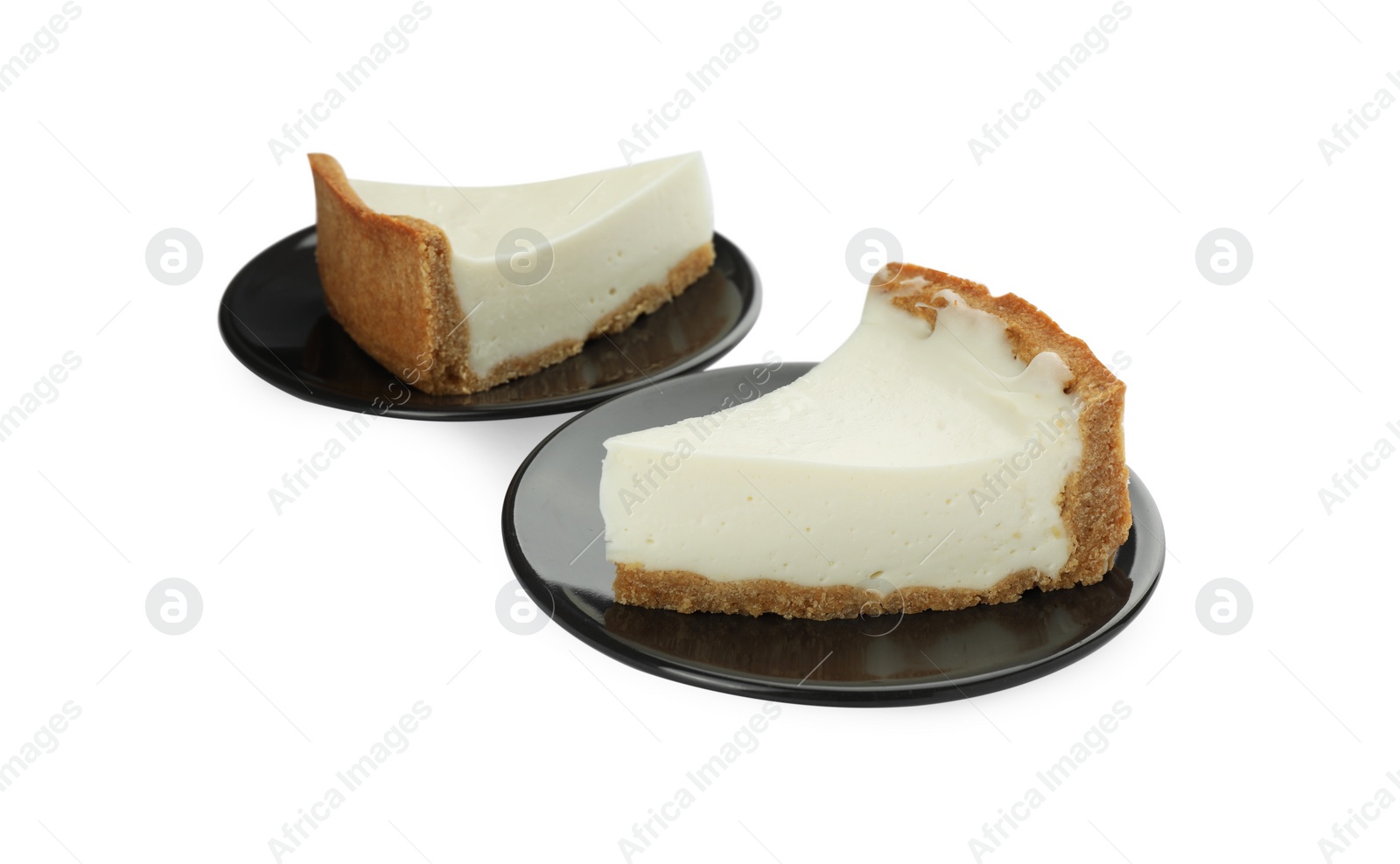 Photo of Pieces of tasty vegan tofu cheesecake isolated on white