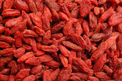 Many dried goji berries as background, closeup. Healthy superfood