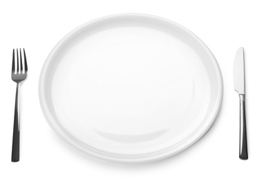 Photo of Empty plate and cutlery on white background. Table setting