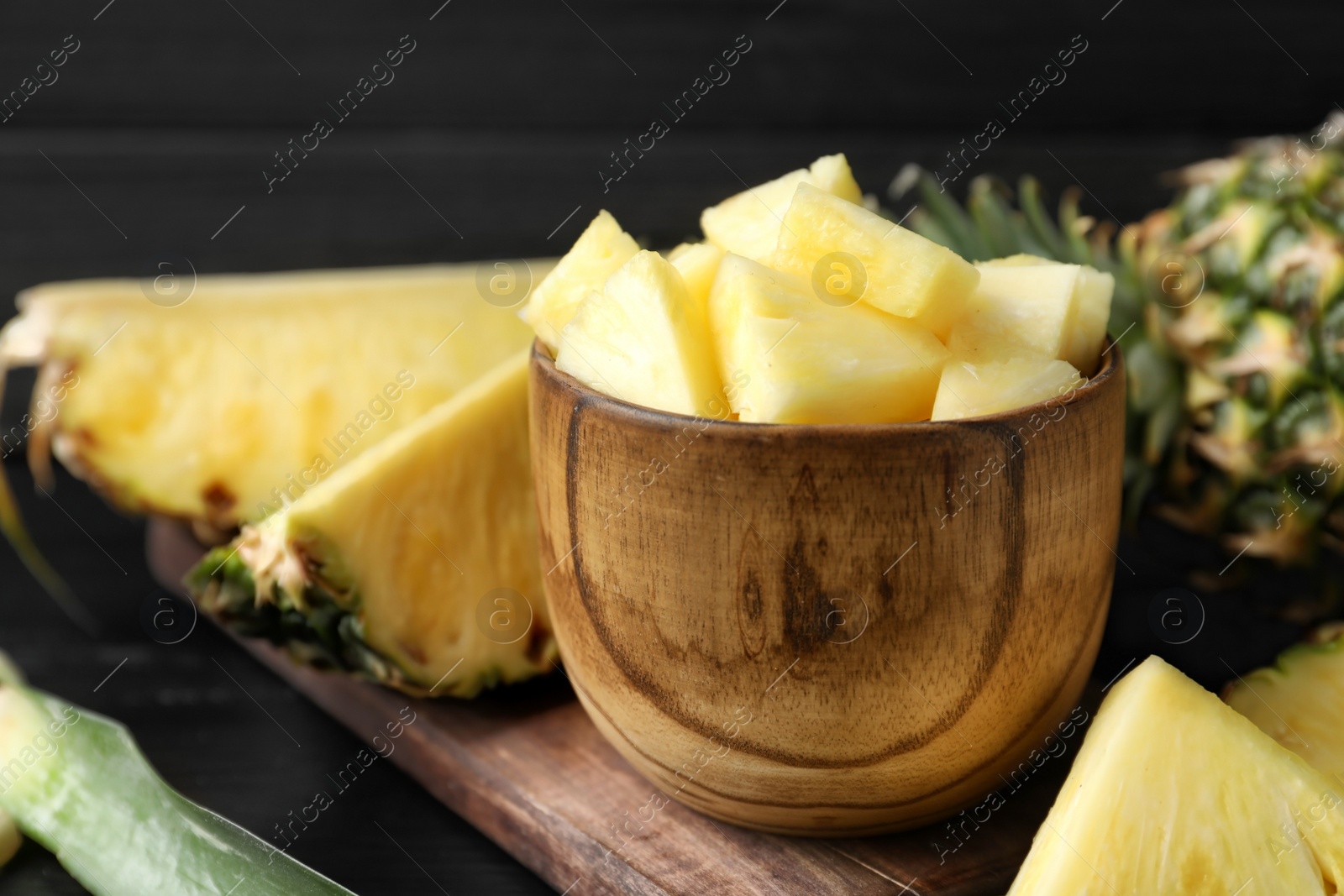 Photo of Bowl with fresh sliced pineapple, closeup