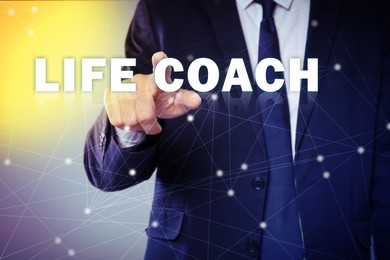 Image of Life coaching concept. Businessman touching virtual screen on color background, closeup