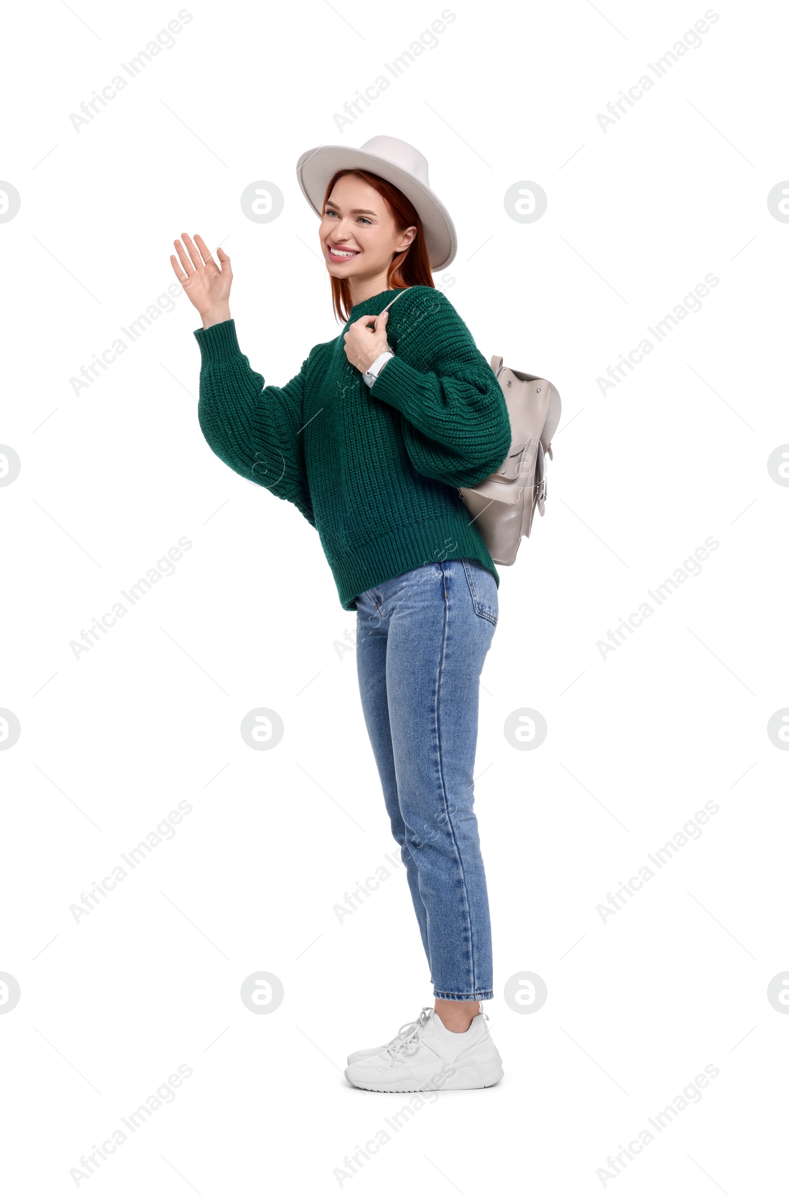 Photo of Happy woman in hat with backpack on white background