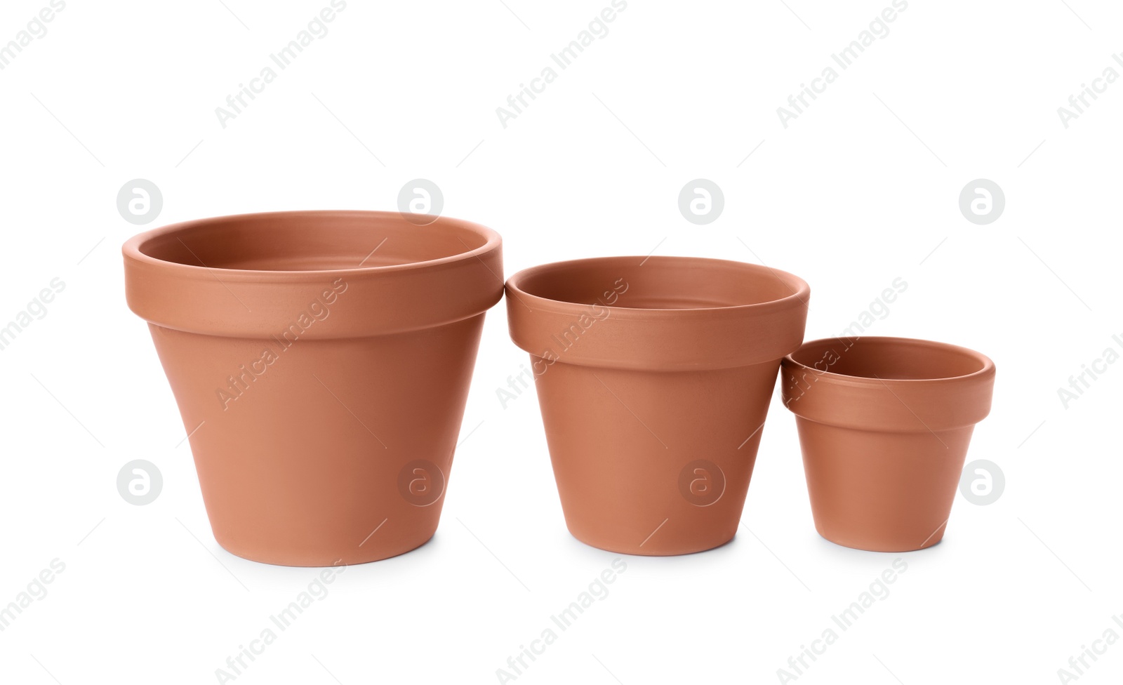 Photo of Stylish terracotta flower pots isolated on white