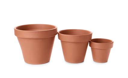 Photo of Stylish terracotta flower pots isolated on white