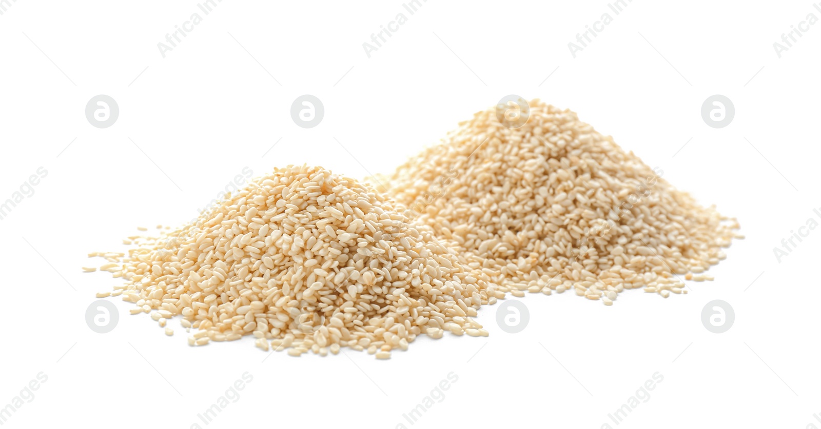 Photo of Piles of sesame seeds on white background