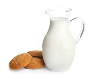 Jug with milk and cookies on white background