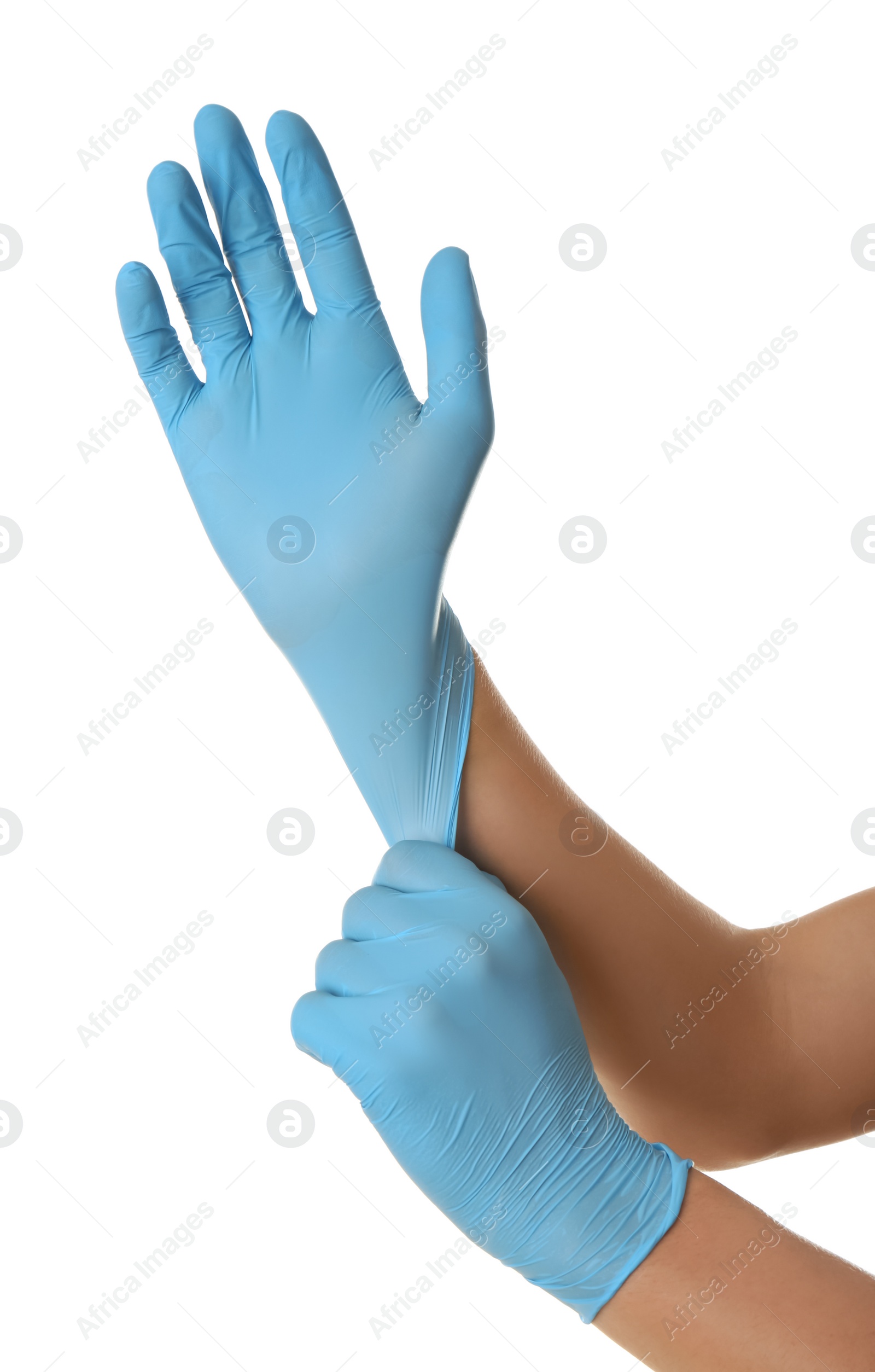 Photo of Person putting on blue latex gloves against white background, closeup