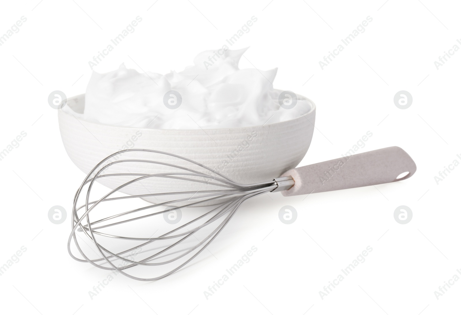 Photo of Bowl with whipped cream and whisk isolated on white