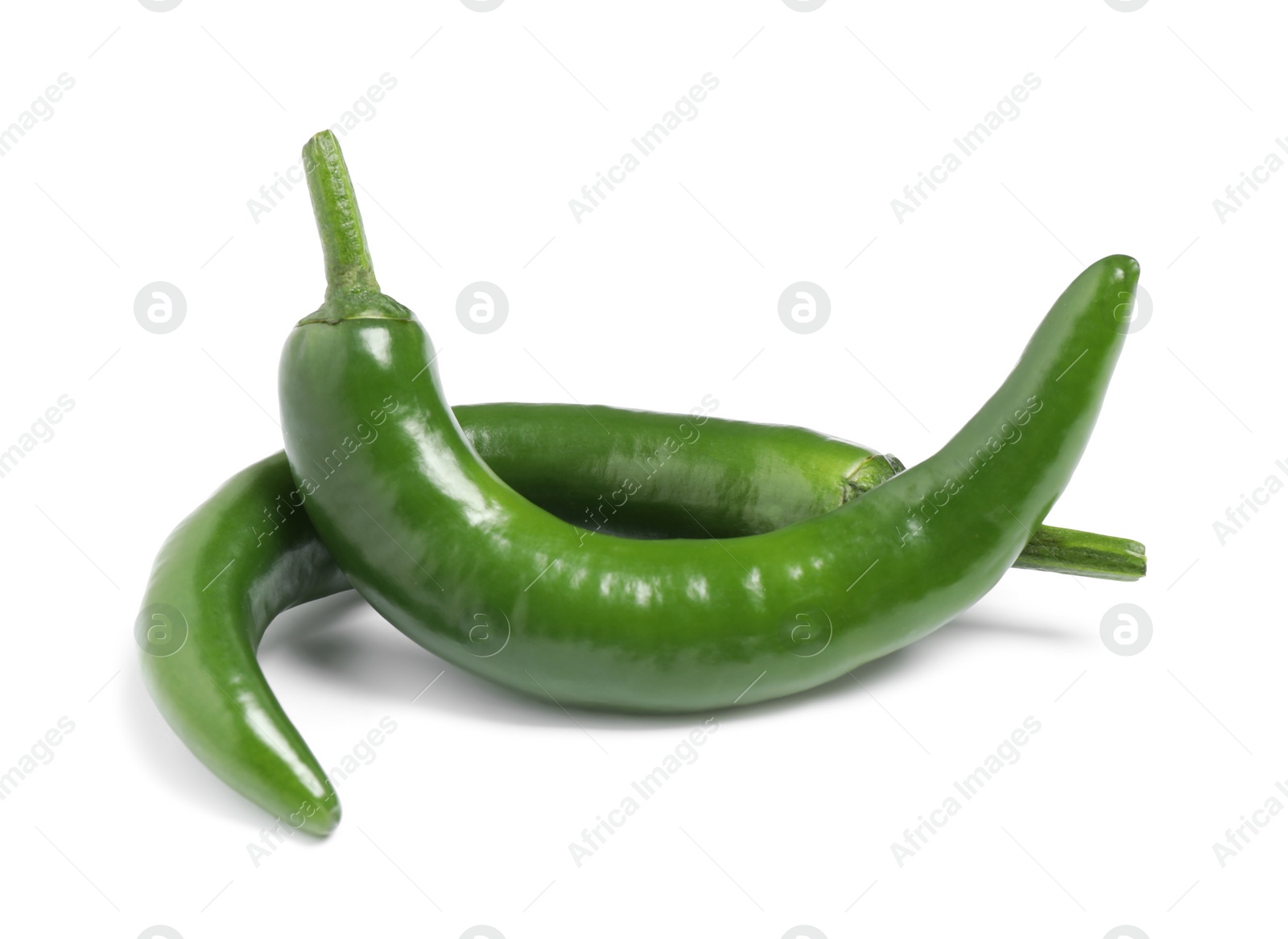 Photo of Green hot chili peppers on white background