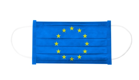 Image of Medical protective mask with European Union flag on white background, top view. Coronavirus outbreak in Europe