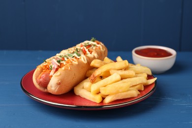 Photo of Delicious hot dog with bacon, carrot and parsley served on blue wooden table, closeup