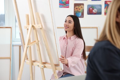 Photo of Women attending painting class in studio. Creative hobby